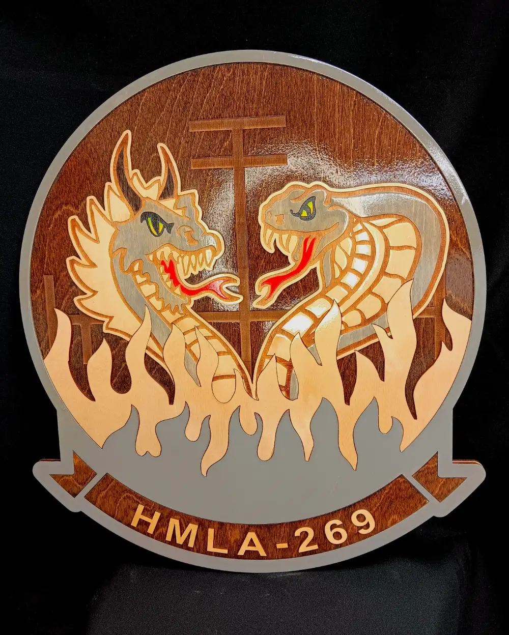 Custom engraved plaque featuring detailed dragon and snake artwork