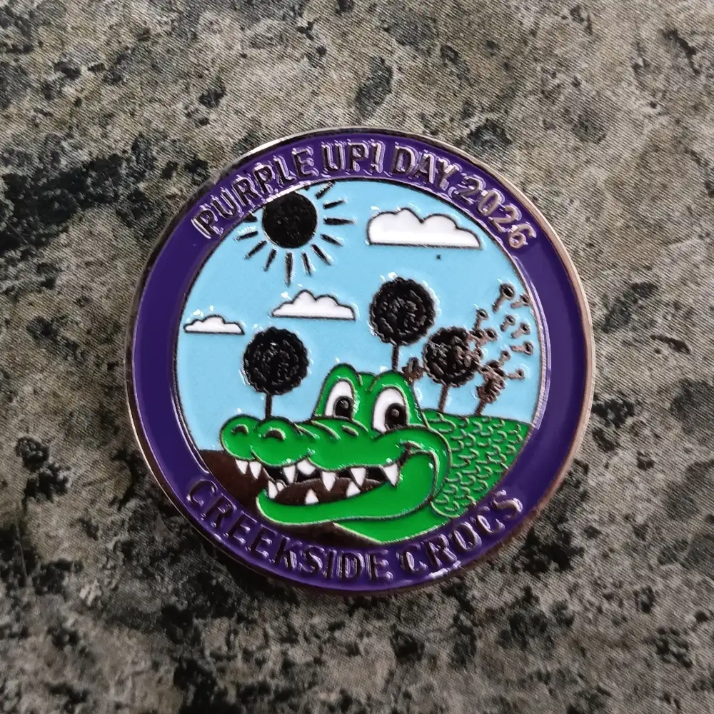 Colorful custom coin featuring a detailed gator design