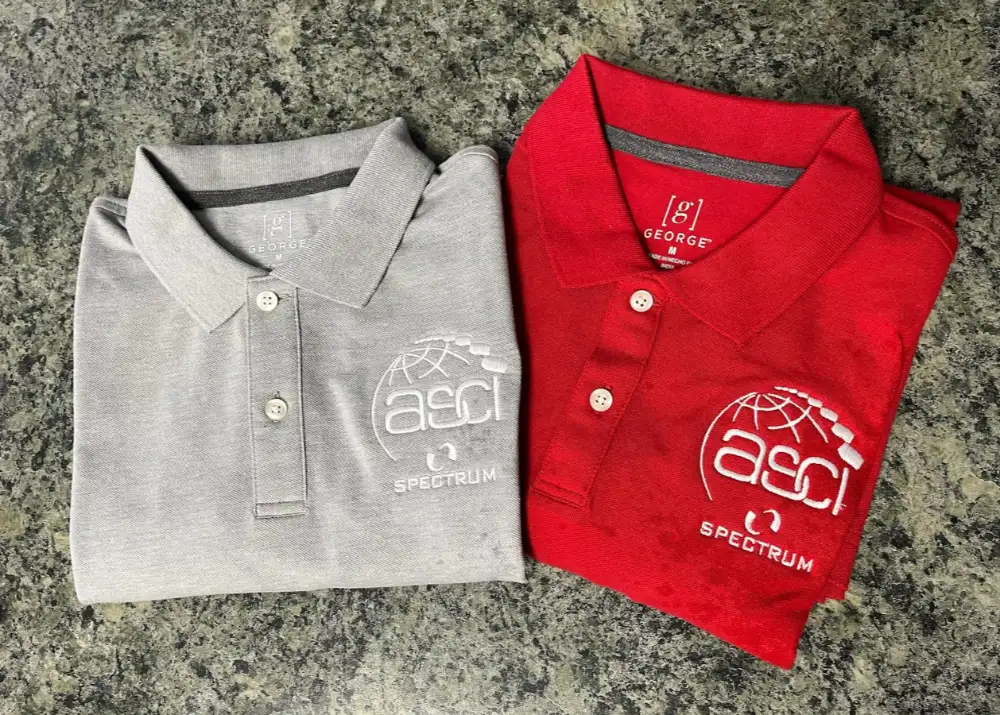 Gray and red polo shirts with custom ASCI Spectrum logo embroidery