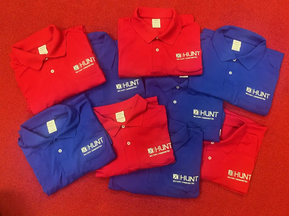 Red and blue polo shirts with custom embroidered logos