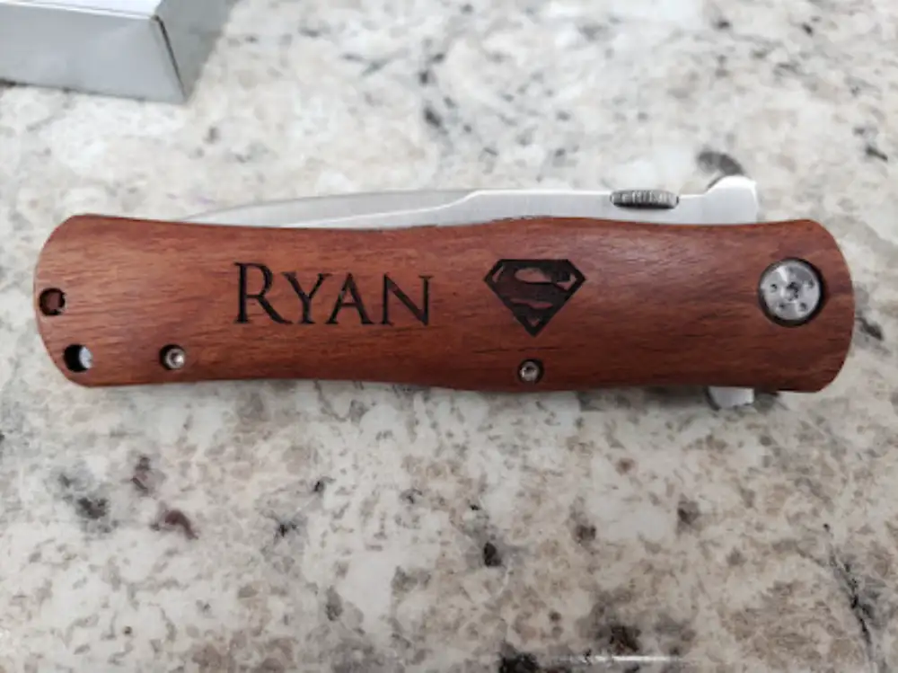 Custom engraved Swiss knife with wooden handle and name Ryan