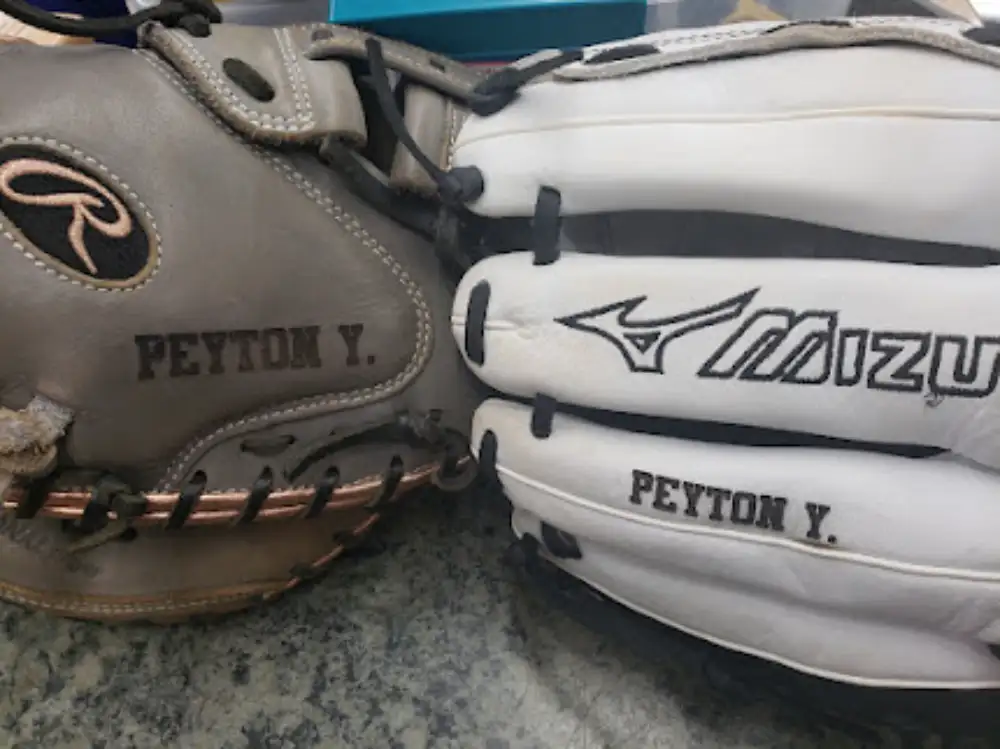 Custom embroidered leather baseball gloves and mitts in brown and white